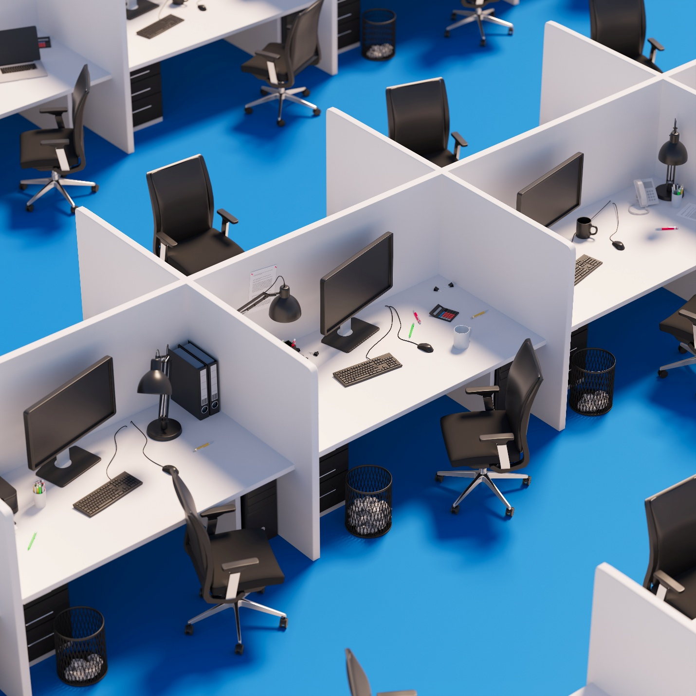 An overhead view of a modern office layout featuring white cubicles with computers, black chairs, and blue flooring.